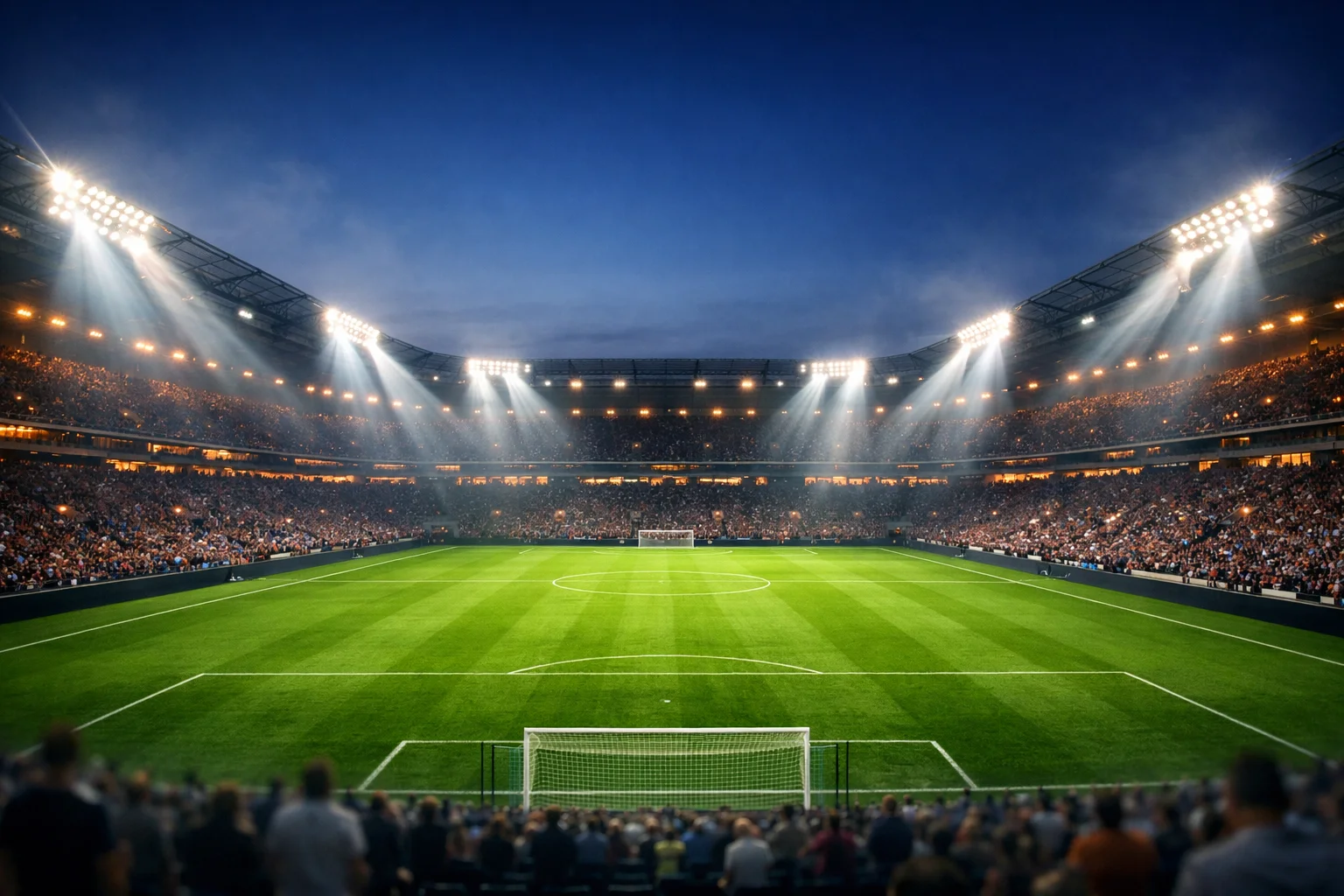 Bundesliga-Stadion unter Flutlicht am Abend vor dem Anpfiff